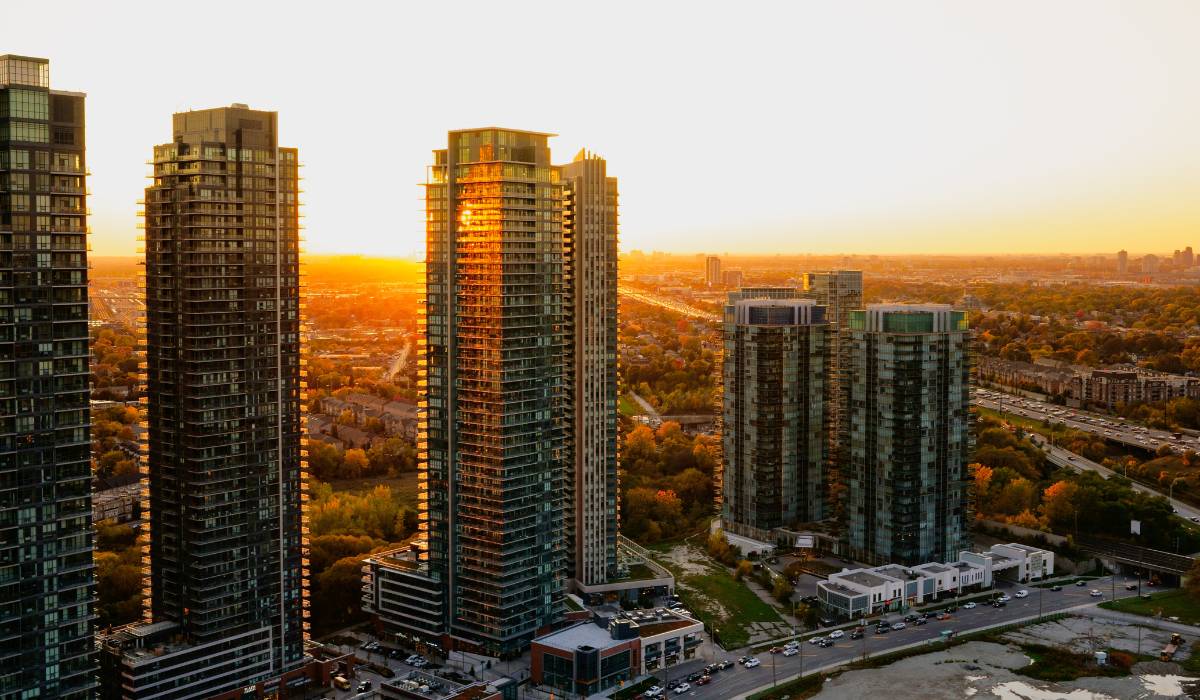 An aerial view of some condos at sunset