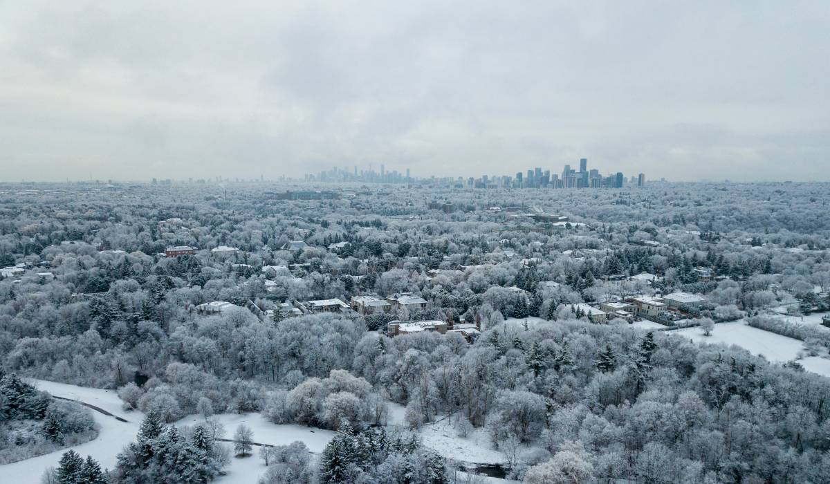 An aerial view of a city covered in snow