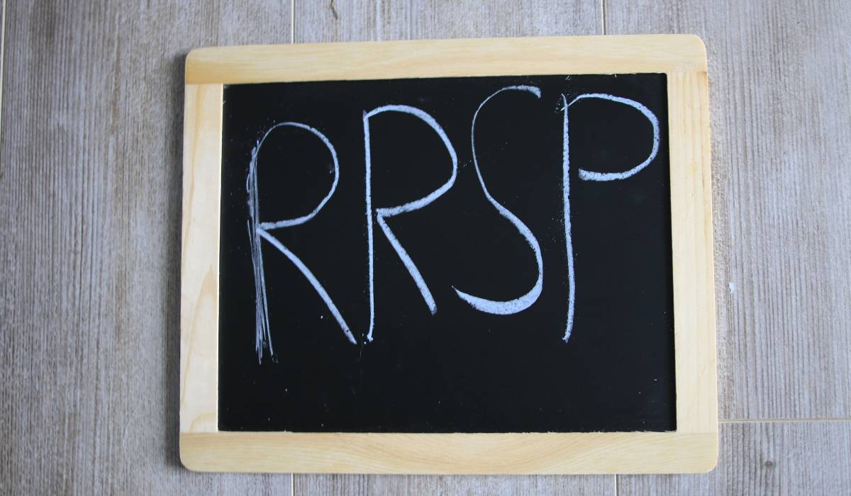 rrsp written on a black board with a wooden frame
