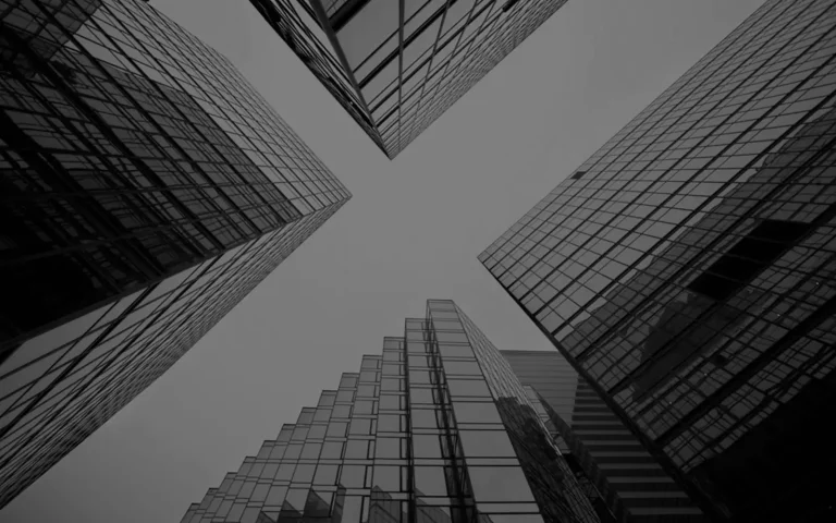 achromatic image of view of group of condo buildings from ground up
